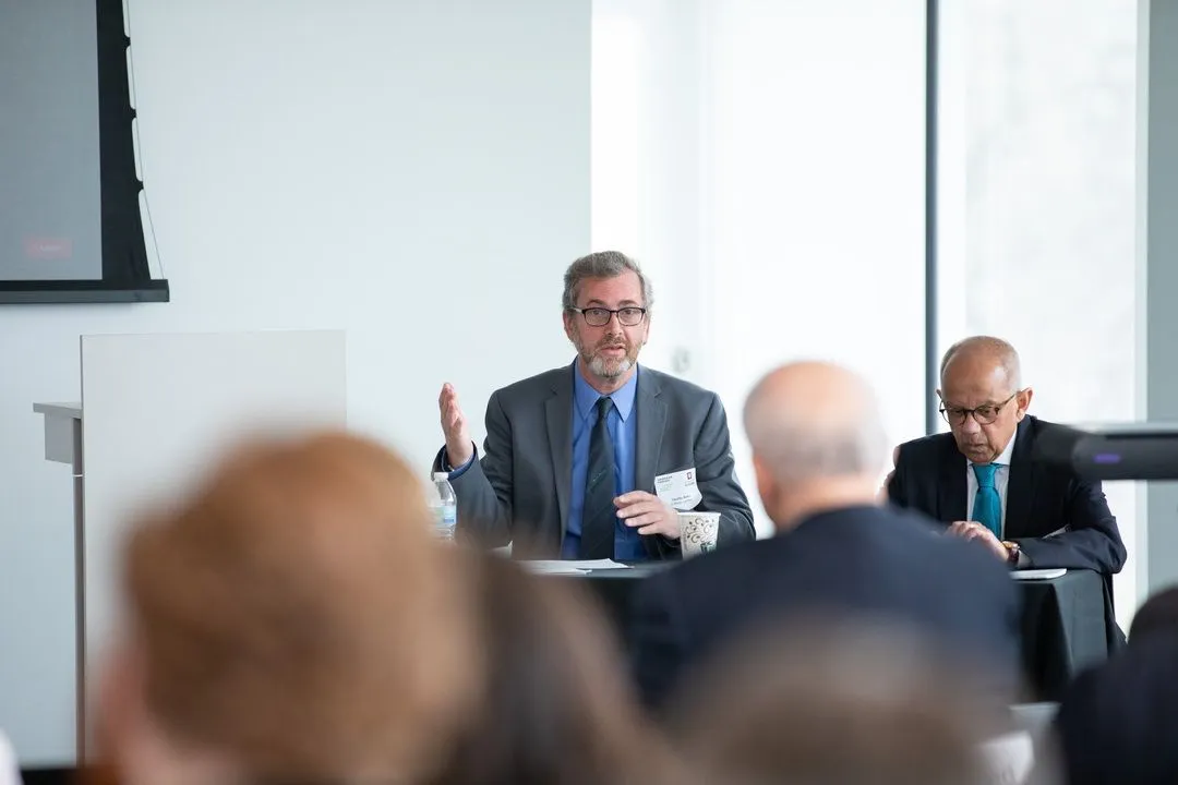 Panelists Sumit Ganguly and Timothy Waters participating in a discussion at an IU/AFAvH conference.