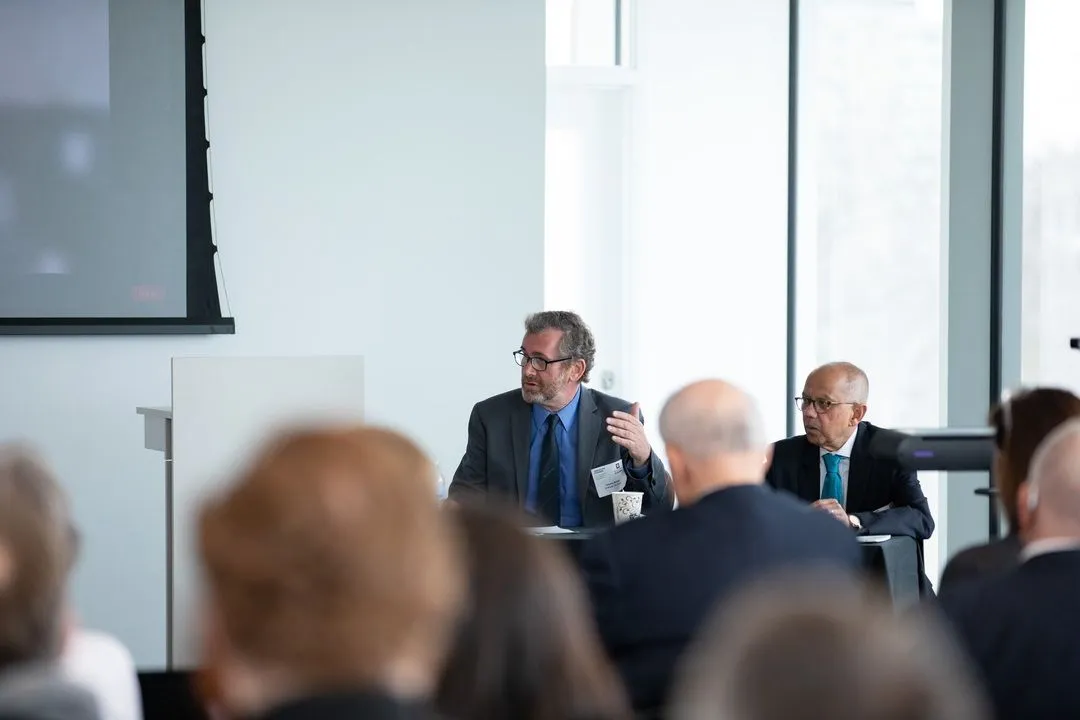 Panelists Sumit Ganguly and Timothy Waters participating in a discussion at an IU/AFAvH conference.