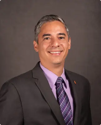 Portrait of Hugo Sanabria, PhD, emphasizing his academic achievements.