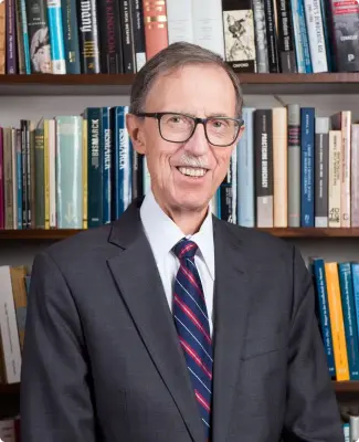 Portrait of John W. Boyer, PhD, emphasizing his research achievements.