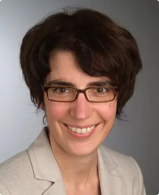 Portrait of Katrin Amian, PhD, showcasing her research achievements.