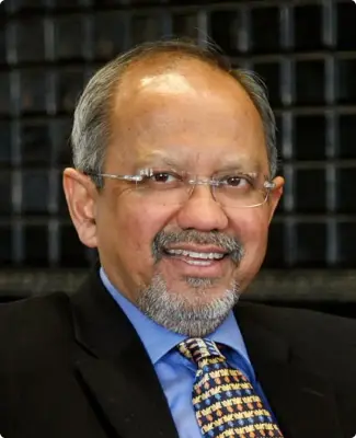 Portrait of Sumit Ganguly, PhD, highlighting his research achievements.