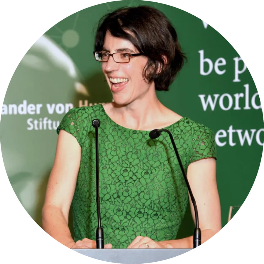 Photo of AFAvH board member Katrin Amian at an AvH event podium.