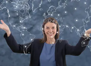 Image of a professional with a world map, emphasizing global research.